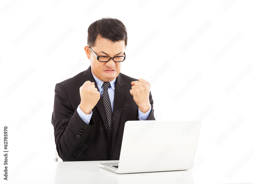 businessman feeling angry and make a fist with laptop businessman feeling angry and make a fist with laptop