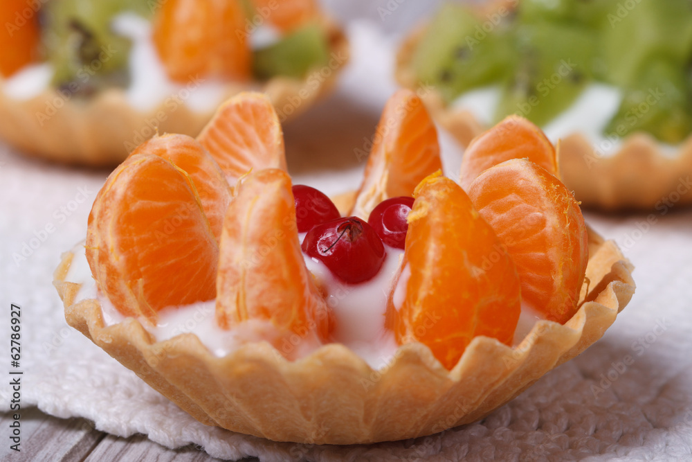 tartlets with mandarins and cranberries close-up