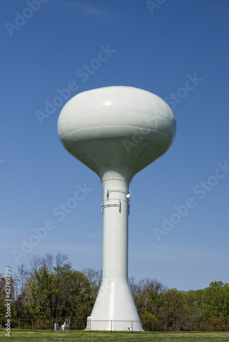 A water tower in the deep blue sky