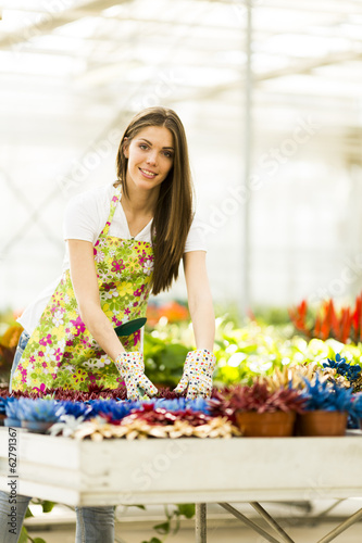 Young woman in flower garden