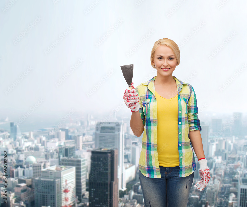 smiling female worker in gloves with spatula smiling female worker in gloves with spatula