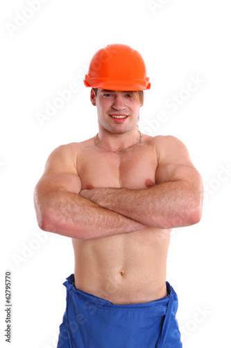Sexy nude mechanic posing on a white background