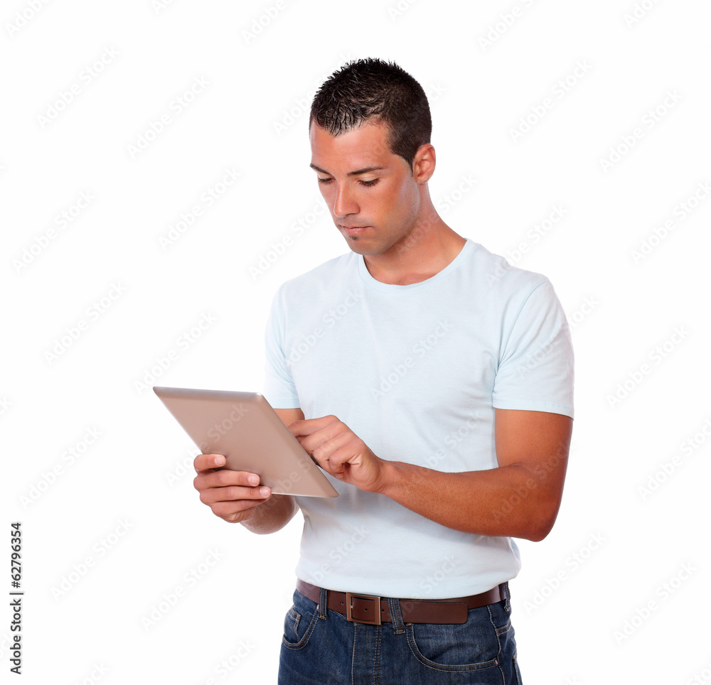 Handsome young man using his tablet pc Handsome young man using his tablet pc