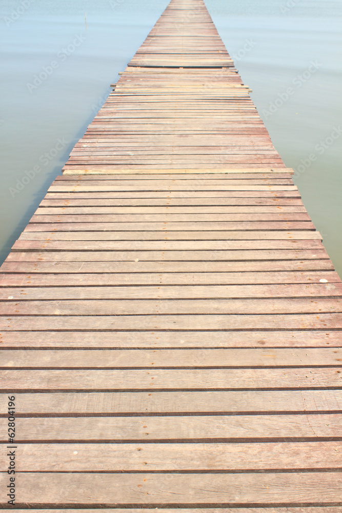 Fototapeta premium Wooden bridge into the sea