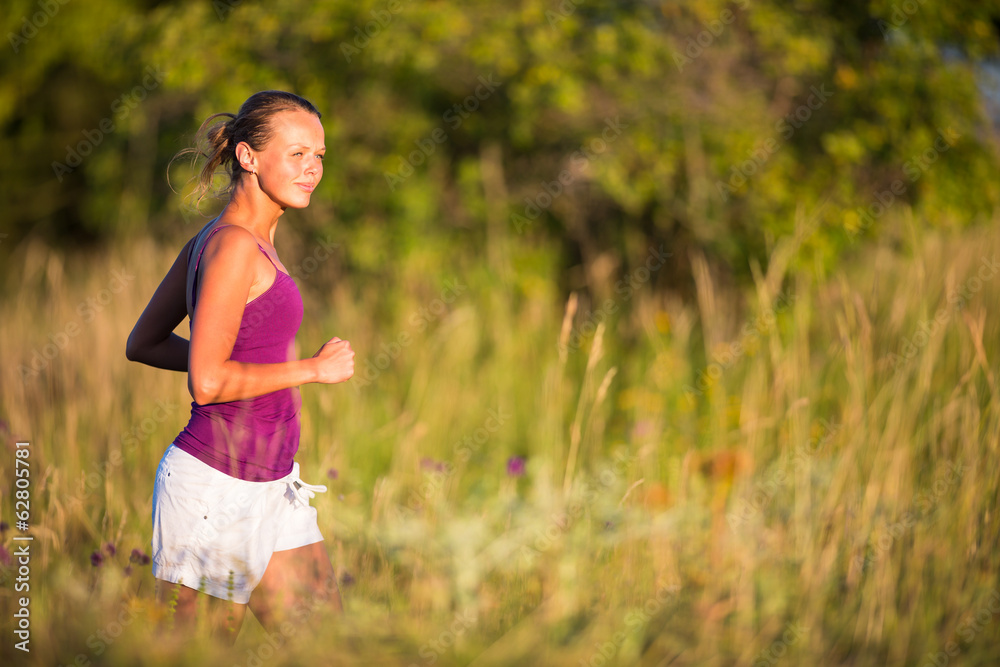 Young woman running outdoors on a lovely sunny day Young woman running outdoors on a lovely sunny day