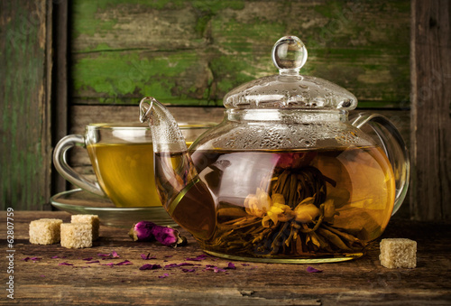 Blooming green tea in glass teapot