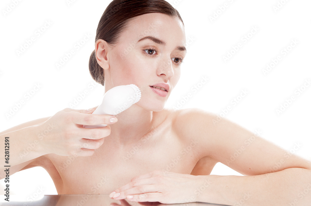 Woman with brush for deep cleansing facial. Skin care concept. H Woman with brush for deep cleansing facial. Skin care concept. H