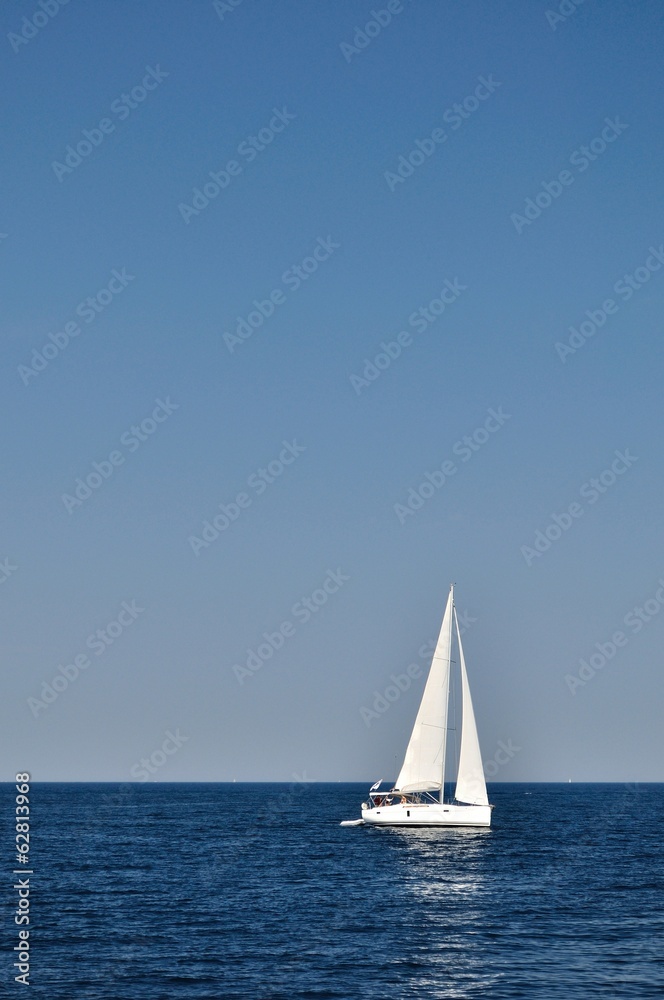 White boat alone on open blue adriatic sea. Croatia