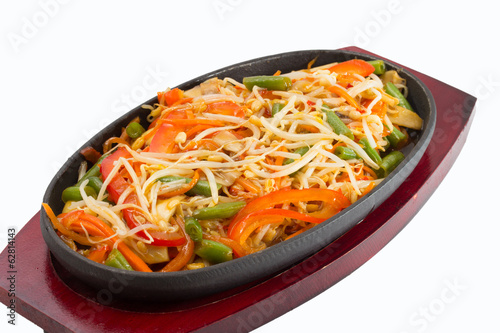 Thai noodles with vegetables isolated on white background