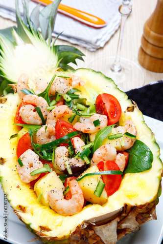 Naklejka Shrimps salad in a pineapple.