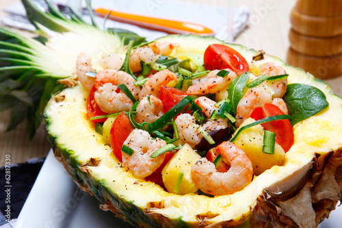 Shrimps salad in a pineapple.
