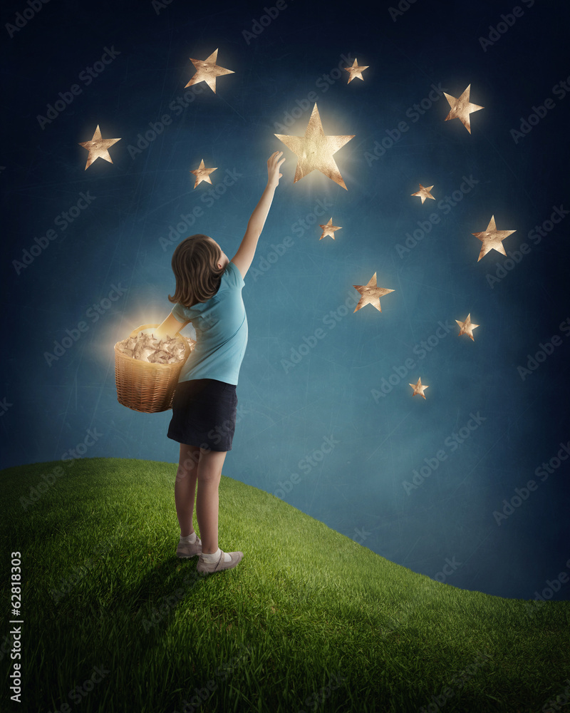 Girl trying to catch a star - obrazy, fototapety, plakaty 