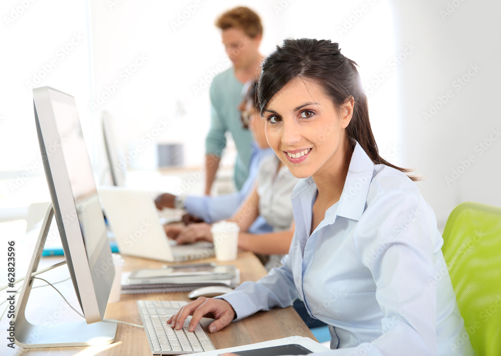 Cheerful young woman attending business training Cheerful young woman attending business training
