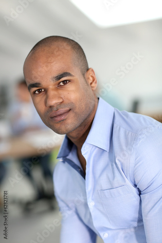 Portrait of young businessman with blue shirt