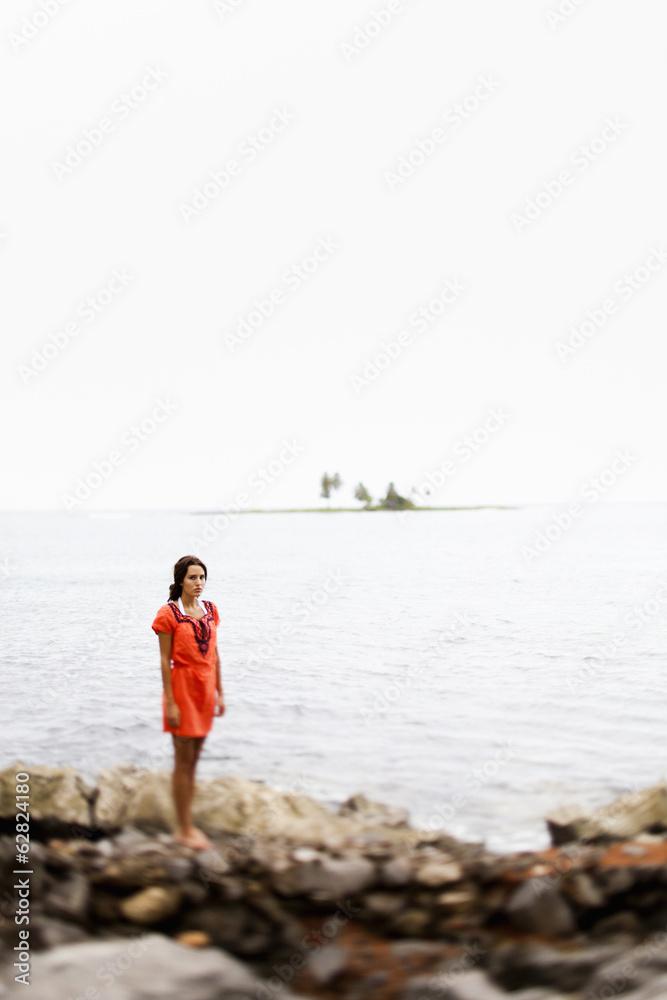 A woman on the beach on a cloudy day in Las Galeras, Samana Peninsula, Dominican Republic. A woman on the beach on a cloudy day in Las Galeras, Samana Peninsula, Dominican Republic.