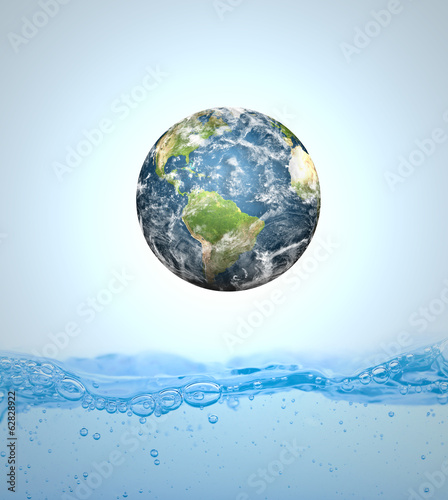 Fototapeta Naklejka Na Ścianę i Meble -  Earth falling into water (Elements of this image furnished by NA