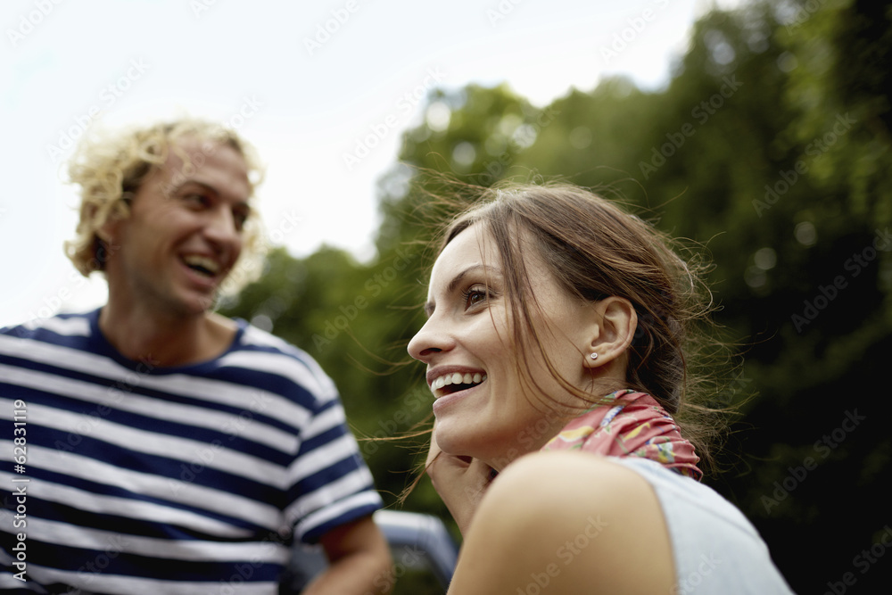A couple, a young man and woman outdoors in woodland. A couple, a young man and woman outdoors in woodland.