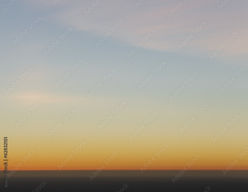 A view over the Pacific Ocean and the sunset on the horizon. A view over the Pacific Ocean and the sunset on the horizon.