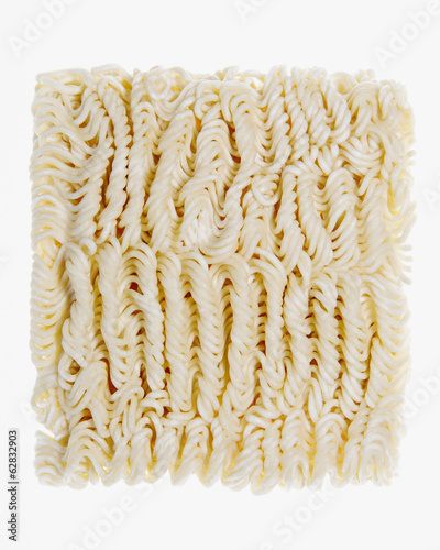 Organic wheat flour ramen noodles, a portion of dried noodles on a white background. photo