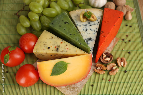 Different Italian cheese on table photo