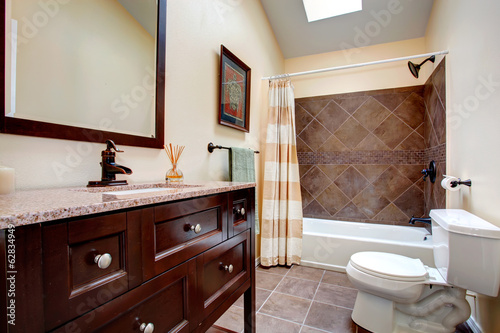 Elegant bathroom with tile wall trim