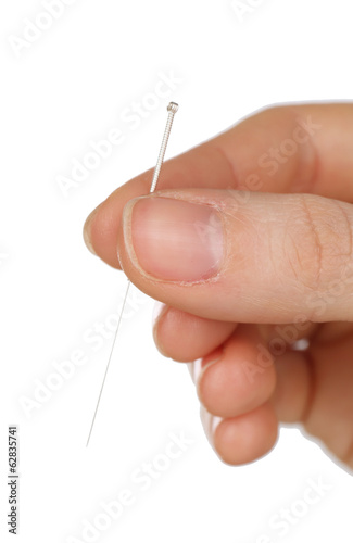 Hand holding needle for acupuncture