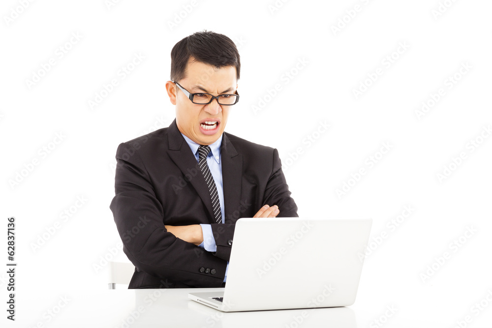 angry businessman look at laptop and cross arms angry businessman look at laptop and cross arms