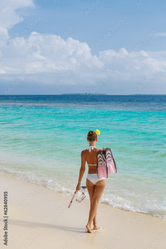 Beach woman snorkeling walk happy, enjoying the sun and holidays