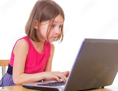  girl sitting at a laptop.