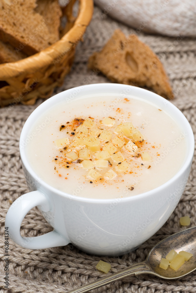 cream soup of cauliflower with cheese and pepper, vertical cream soup of cauliflower with cheese and pepper, vertical