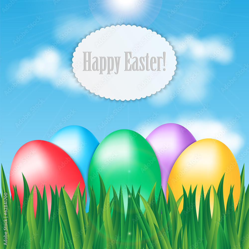 Colorful Easter eggs on green grass on blue sky background and f