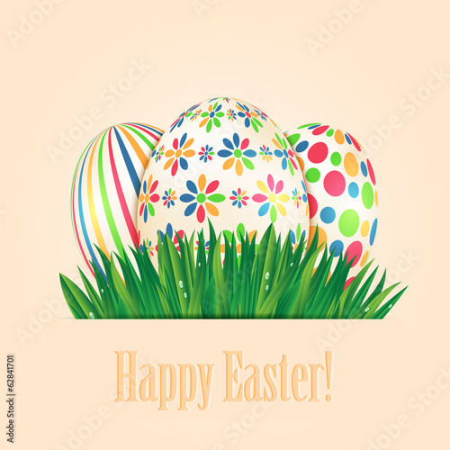 Easter eggs with colorful patterns and green spring grass
