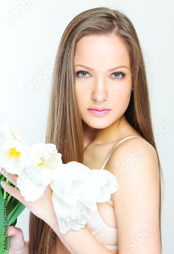 Portrait of a beautiful woman with flowers.
