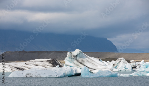 blue icebergs, lagoon and storm