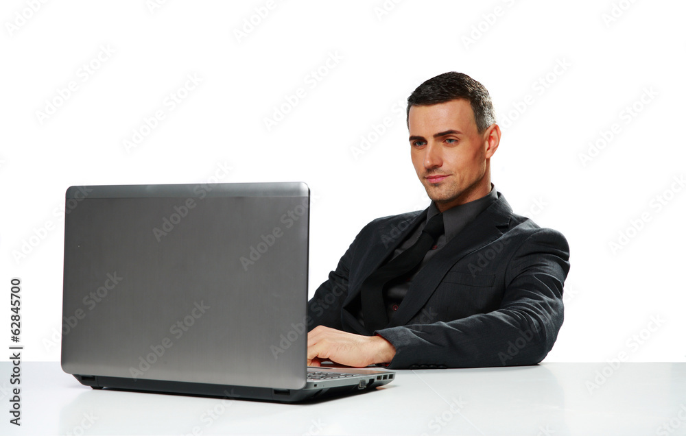 Confident businessman working on laptop Confident businessman working on laptop