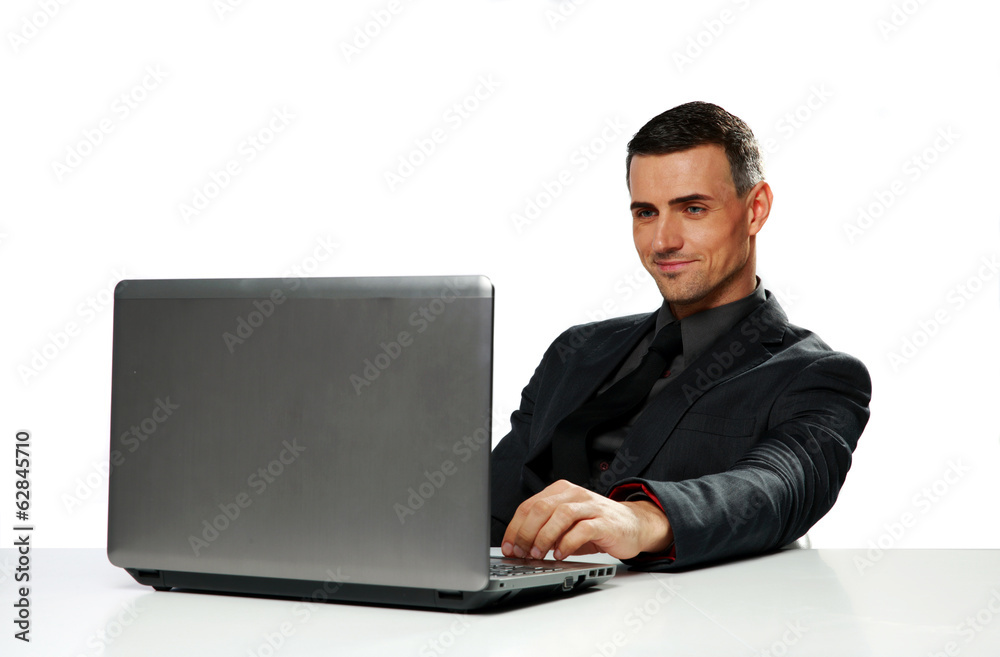 Happy businessman working on laptop Happy businessman working on laptop