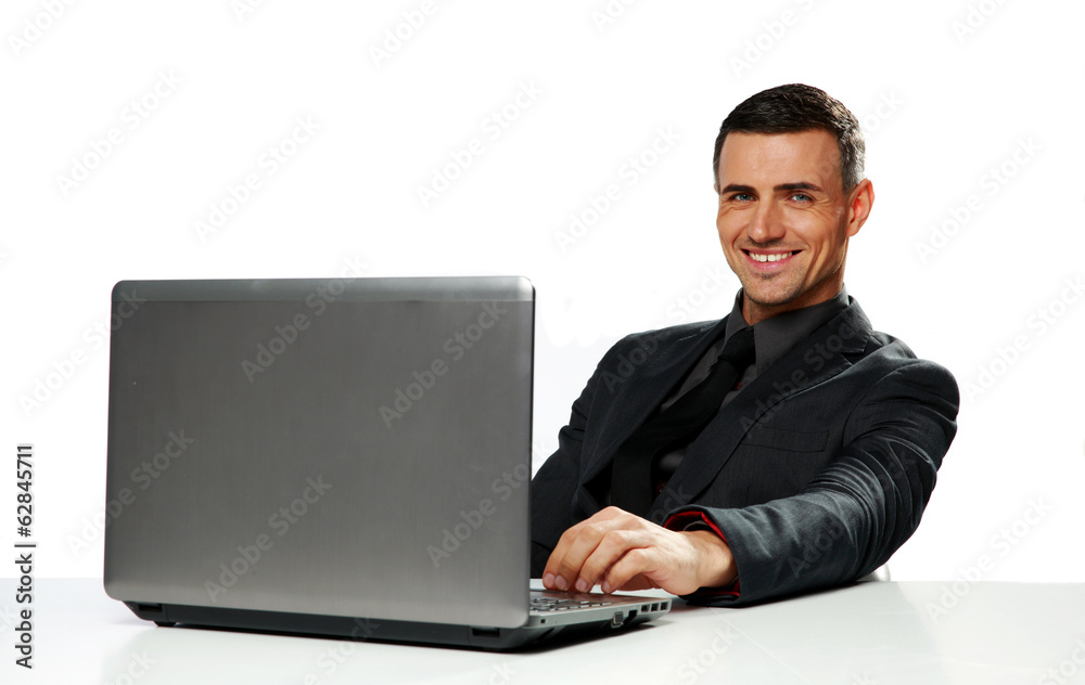 Smiling businessman sitting at the table Smiling businessman sitting at the table
