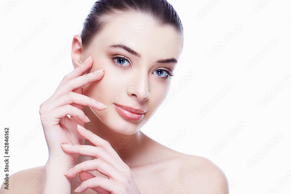 Fototapeta premium Beauty Portrait. Beautiful Spa Woman Touching her Face