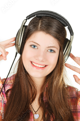 portrait of smiling girl in headsets, that holds them hands