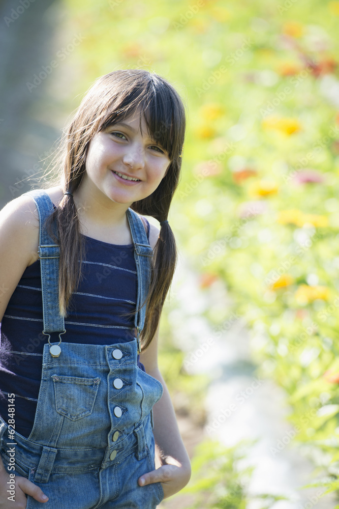 Summer on an organic farm. A young girl in a field of flowers. Summer on an organic farm. A young girl in a field of flowers.