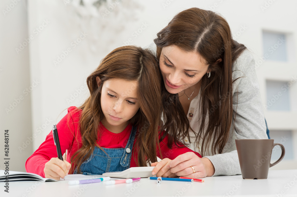 Mother Helping Her Daughter While Studying Mother Helping Her Daughter While Studying