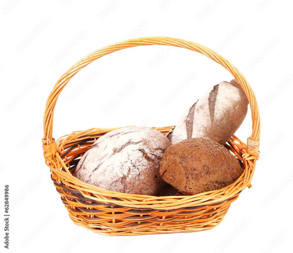 Composition with bread and rolls in wicker basket