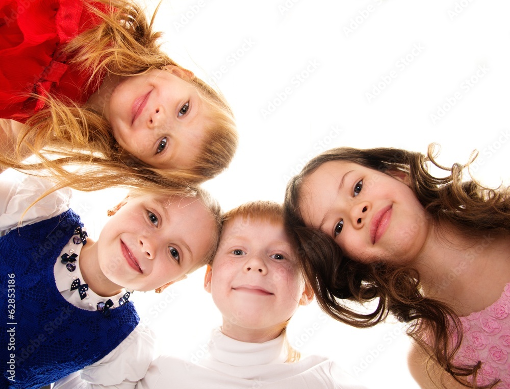 Croup of happy children standing in a circle Croup of happy children standing in a circle
