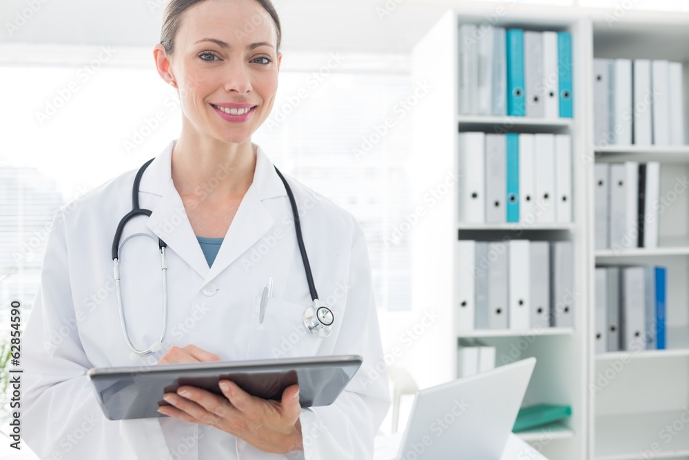 Portrait of doctor using digital tablet