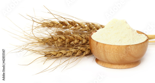 Wheat and flour on a bowl