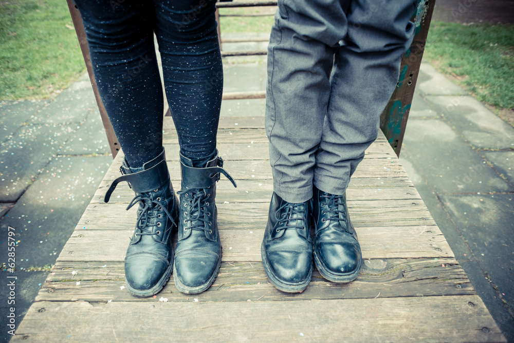 close up legs of young modern stylish couple