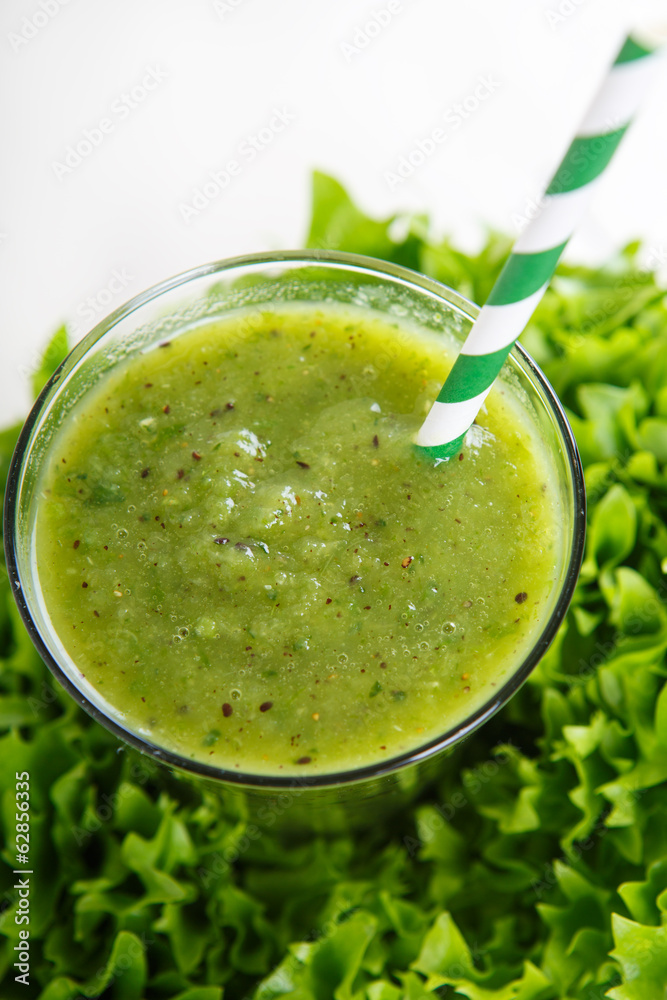 Fresh organic green smoothie with salad, apple, cucumber, pineap Fresh organic green smoothie with salad, apple, cucumber, pineap