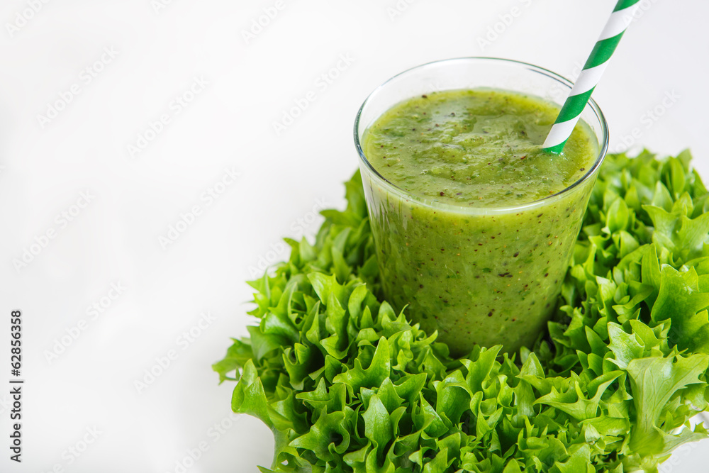Fresh organic green smoothie with salad, apple, cucumber, pineap Fresh organic green smoothie with salad, apple, cucumber, pineap
