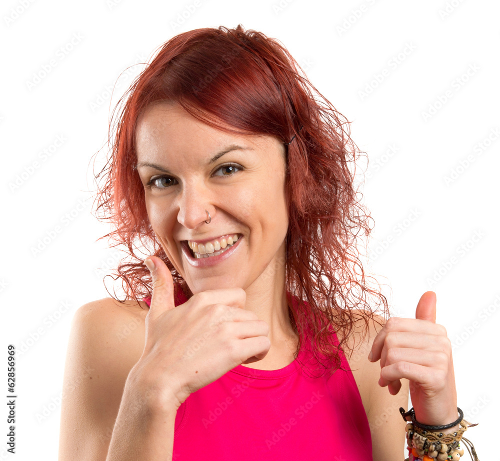 Young pretty girl with thumbs raised. Young pretty girl with thumbs raised.