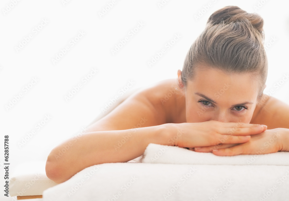 Young woman laying on massage table Young woman laying on massage table